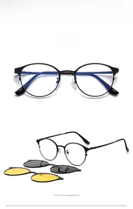 Detail of round magnetic clip-on sunglasses set with yellow and black lenses