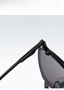 Detail of polarized square sunglasses frame hinge and textured temple with glossy finish