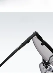 Close-up of metal hinge and polarized lens on these round magnetic clip-on sunglasses