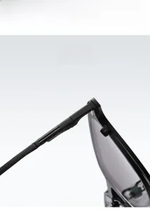 Detail of high-gloss square frame with reinforced metal hinge and polarized lens