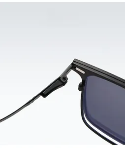 Macro view of the flexible spring hinge on these black square polarized sunglasses