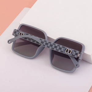 Detail of grey-purple matte oversized sunglasses with gradient lenses and G-pattern temples