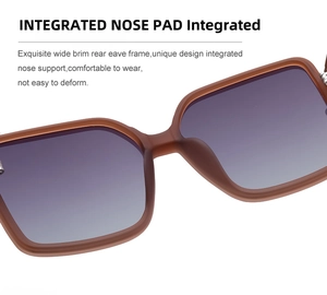 Detail of integrated nose pads on brown matte sunglasses with purple gradient lenses