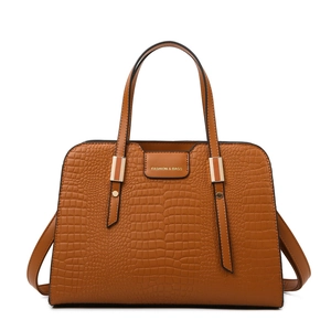 Brown crocodile pattern tote bag with top handles and shoulder strap in a minimalist design