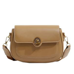 Vintage camel saddle bag with retro bronze relief buckle on clean white background