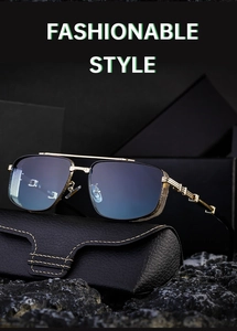 Detail of gold metal frame sunglasses with gradient blue lenses on black leather case