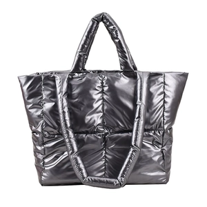 Quilted down puffer tote bag in metallic silver with top handles and shoulder straps