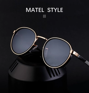 Detailed close-up of retro round metal sunglasses with unique checkered temples on black base