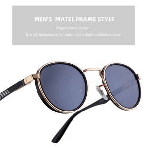 Detail of retro round metal frame sunglasses with carbon fiber texture on temples