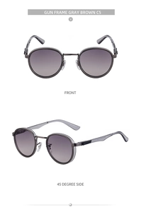 Detail view of gunmetal round frame sunglasses with brown gradient lenses and nose pads