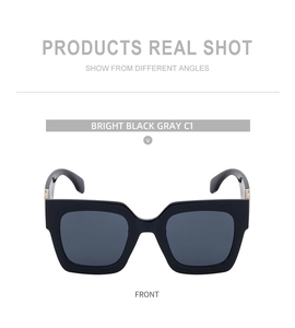 Front view of square black sunglasses with gray lenses and a minimalist frame design