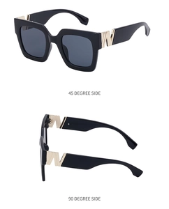 Detail view of square black sunglasses with golden W logo at 45 and 90 degree angles