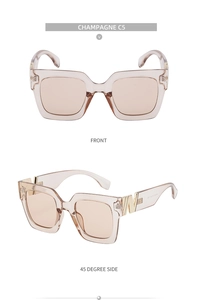 Close-up of champagne square sunglasses with golden W-shaped metal decorative temples