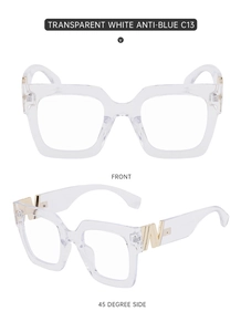 Detail view of transparent square frames with golden W metal accents and anti-blue lenses