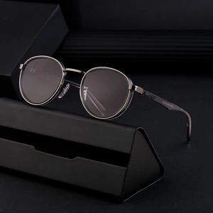 Retro round metal frame sunglasses in gunmetal grey with a black triangular leather case