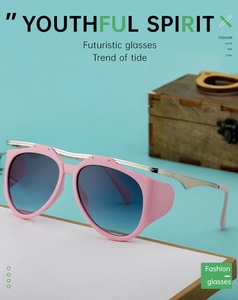 Detail of futuristic sunglasses with pink frames and blue gradient lenses on blue background