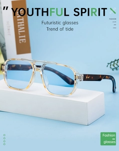Detail of futuristic sunglasses with light blue lenses and tortoiseshell temples