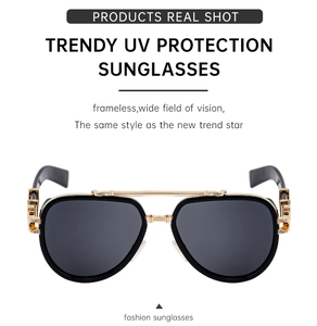 Detail of polarized sunglasses with golden metal hinges and UV protection lenses