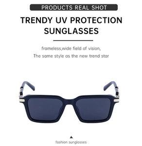Detail of rectangular polarized sunglasses with gold hinges and UV protection lenses