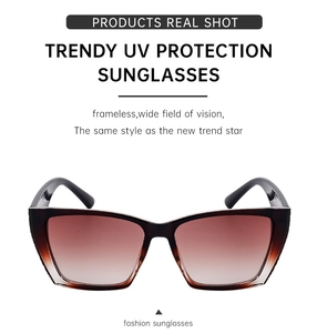 Detail showing frameless cat-eye sunglasses with gradient brown UV protection lenses