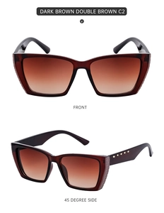 Detail of dark brown cat-eye sunglasses with golden diamond rivets and embossed frame