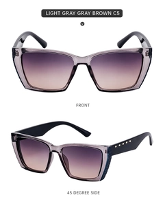Detailed front and side views of light gray cat-eye sunglasses with golden rivets