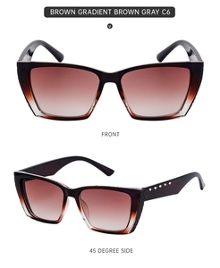 Close-up of brown gradient cat-eye sunglasses with quilted temple and gold accents