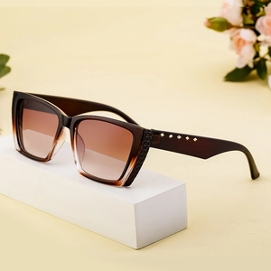 Fashionable square cat-eye sunglasses with brown gradient lenses and gold rivet accents