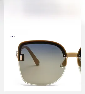 Detail of gradient brown lenses and champagne gold metal frame on polarized sunglasses