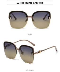 Detail of polarized oversized sunglasses with tea frames and golden metal logo accents