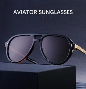 Detail of aviator sunglasses with gold textured temples and silver arrow accents on frames