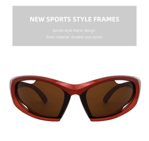Detail view of bold red Y2K sports sunglasses with wraparound frames and dark brown lenses