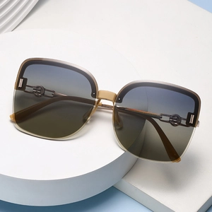 Women's polarized oversized semi-rimless sunglasses with gradient lenses and chain temple