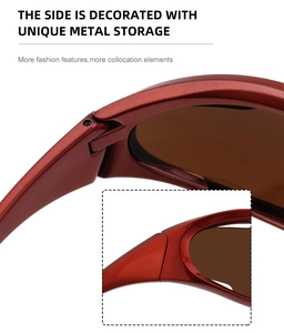Detail of burgundy Y2K sports sunglasses with metal hinge accents and brown lenses