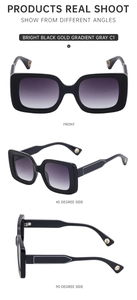 Detail view of large rectangular sunglasses in bright black and gold gradient gray