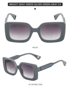 Detail of square gray-green sunglasses featuring gradient purple lenses and metal logo