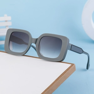 Square grey thick frame sunglasses with blue gradient lenses in a modern minimalist style