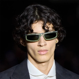 Detail of trendy camo rectangular sunglasses featuring a tactical frame and dark lenses