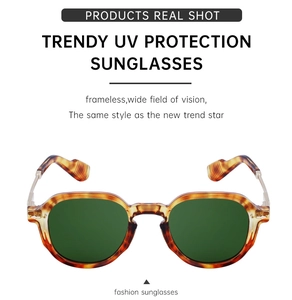Detail of tortoise shell patterned sunglasses with dark green polarized UV lenses