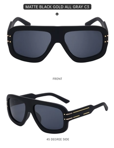 Detail view of matte black square sunglasses with gold metal accents and grey lenses