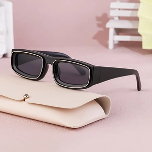 Vintage rectangular sunglasses in black with gold metal trim and folding leather case