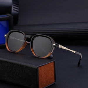 Polarized sunglasses with amber gradient D-frames and golden metal temples on leather case