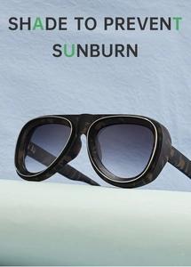 Détail de lunettes pilote camouflage avec verres dégradés et bordure en métal argent