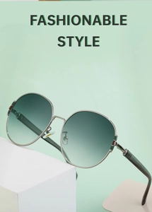 Detail of silver metal frame sunglasses with gradient green lenses and nose pads