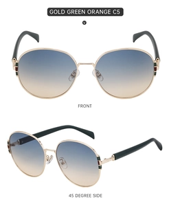 Detailed view of gold metal round sunglasses with blue-orange gradient lenses and striped arms