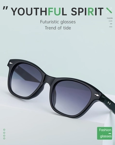 Detail of minimalist black square polarized sunglasses with gray gradient lenses and metal accents