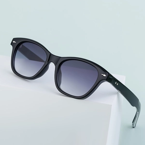 Classic black acetate polarized sunglasses with silver arrow rivets and grey lenses