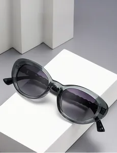 Detail of dark gray polarized sunglasses featuring unique wavy textured temple arms