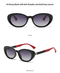 Cat-eye sunglasses with black frame, red chain-link arms, and gold flower detail