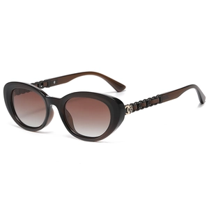 Brown cat eye polarized sunglasses with woven metal leather temples and floral hinge detail